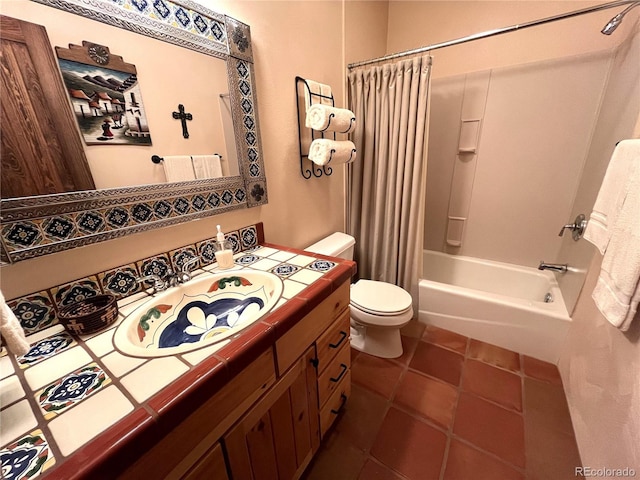 full bathroom with vanity, shower / bath combo with shower curtain, toilet, and tile patterned floors