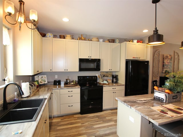 219 Summitview Ln, Poncha Springs, CO 81201 - kitchen with black appliances, light wood-type flooring, light countertops, recessed lighting, and pendant lighting