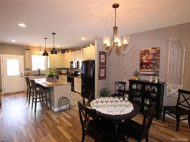 219 Summitview Ln, Poncha Springs, CO 81201 - dining space featuring a chandelier, wood finished floors, and recessed lighting