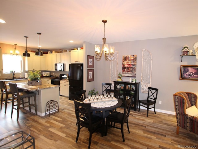 219 Summitview Ln, Poncha Springs, CO 81201 - dining space featuring a chandelier, light wood-style flooring, and recessed lighting