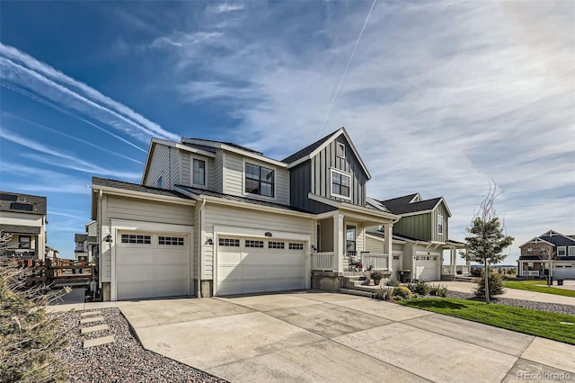 view of front of home with a garage and a porch