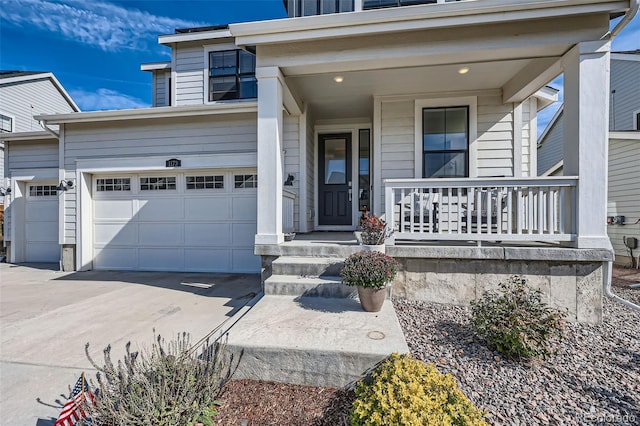 view of front of home with a porch and a garage