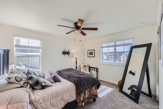 bedroom with light carpet and ceiling fan