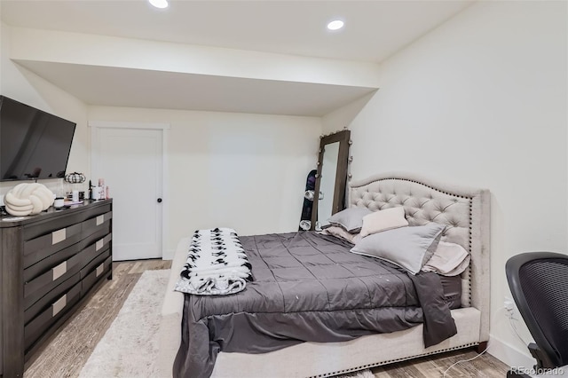 bedroom featuring hardwood / wood-style floors