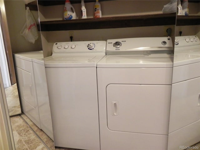 laundry room with independent washer and dryer