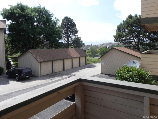 wooden deck featuring a garage