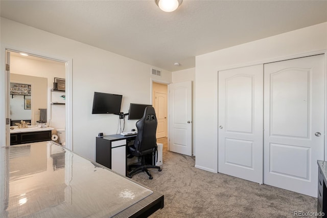 office with visible vents and light carpet