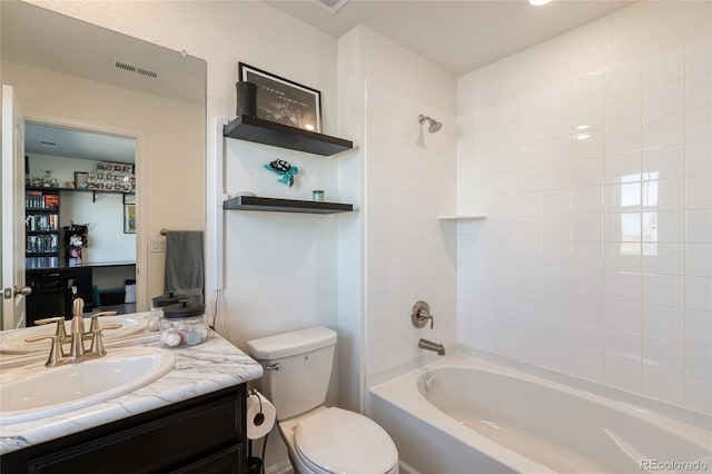 bathroom featuring visible vents, toilet, bathtub / shower combination, and vanity