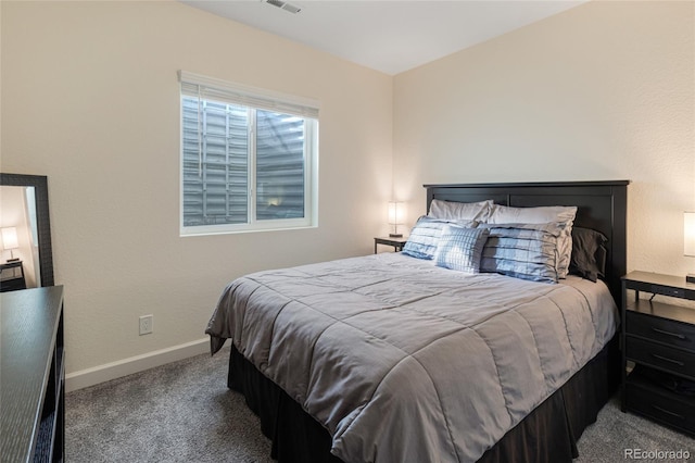 bedroom featuring baseboards, visible vents, and carpet floors