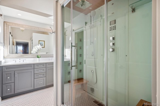 bathroom with vanity and an enclosed shower