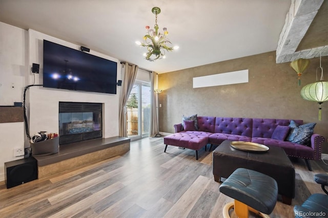 living room featuring a chandelier and hardwood / wood-style floors