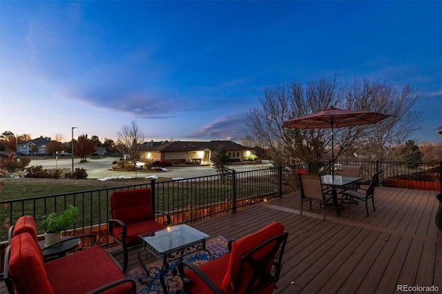 deck at dusk with a yard