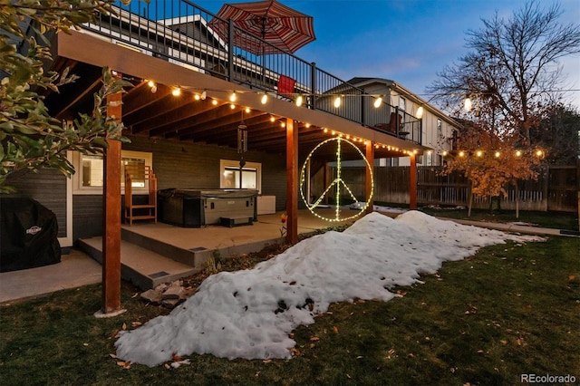 exterior space with a deck, a hot tub, and a patio area