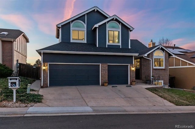 view of front of property with a garage