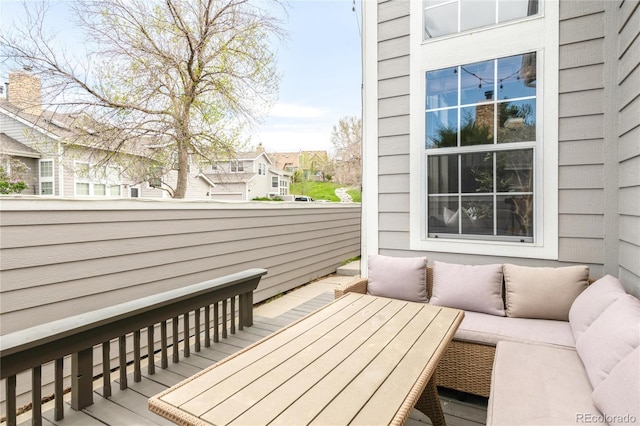 6858 Zenobia St Unit 9, Westminster, CO 80030 - wooden terrace featuring an outdoor hangout area and a residential view