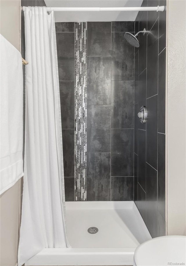 6858 Zenobia St Unit 9, Westminster, CO 80030 - bathroom with a shower stall and toilet