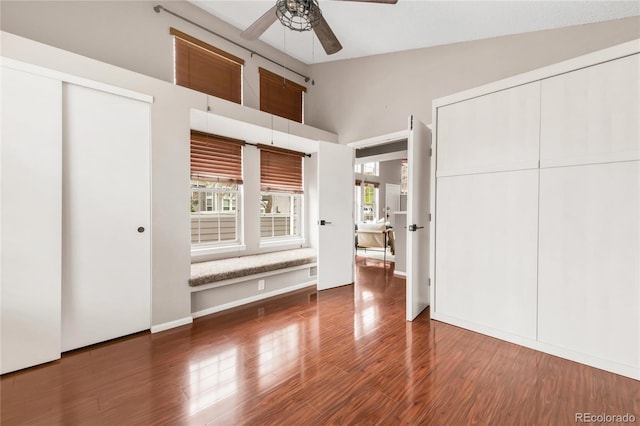 6858 Zenobia St Unit 9, Westminster, CO 80030 - unfurnished bedroom with high vaulted ceiling, wood finished floors, baseboards, and ceiling fan