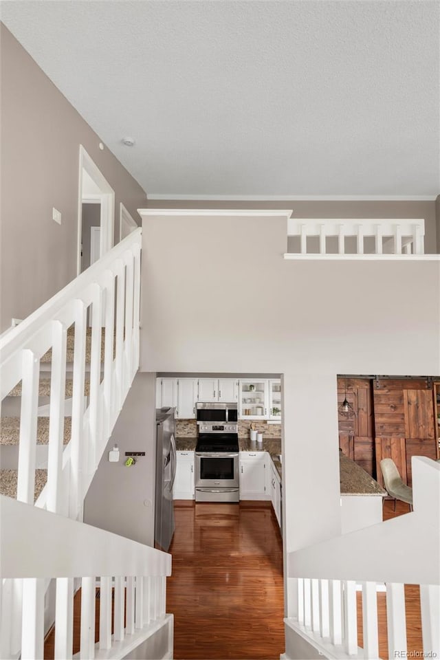 6858 Zenobia St Unit 9, Westminster, CO 80030 - stairway featuring wood finished floors