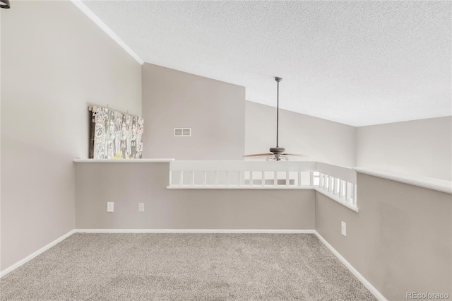 6858 Zenobia St Unit 9, Westminster, CO 80030 - unfurnished room with a ceiling fan, carpet, baseboards, a textured ceiling, and lofted ceiling