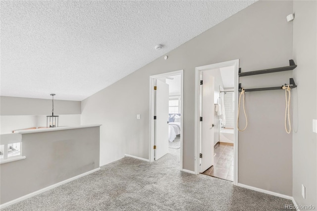 6858 Zenobia St Unit 9, Westminster, CO 80030 - unfurnished living room with a textured ceiling, carpet floors, and baseboards