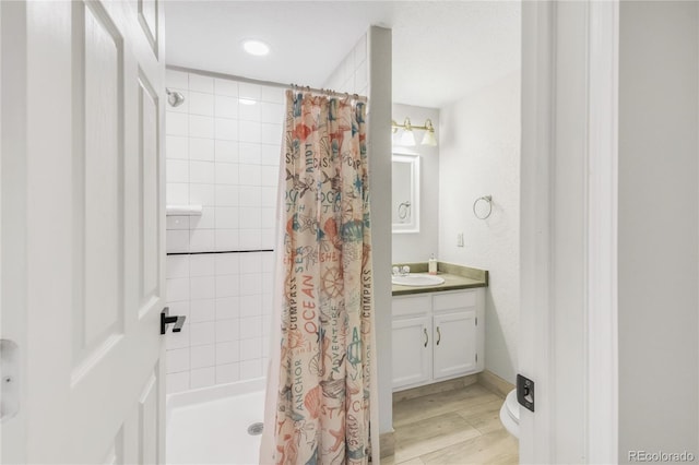 6858 Zenobia St Unit 9, Westminster, CO 80030 - bathroom with a shower stall, vanity, and recessed lighting