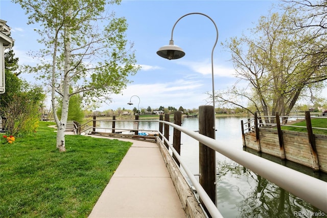 6858 Zenobia St Unit 9, Westminster, CO 80030 - dock area featuring a water view and a lawn