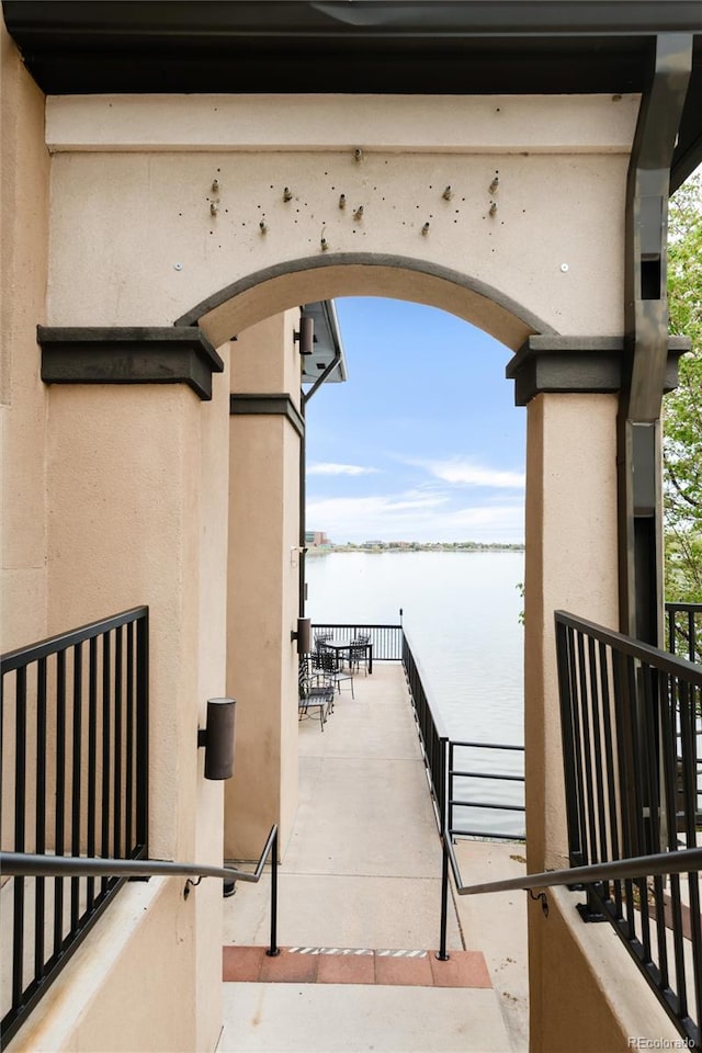 6858 Zenobia St Unit 9, Westminster, CO 80030 - view of patio / terrace with a water view