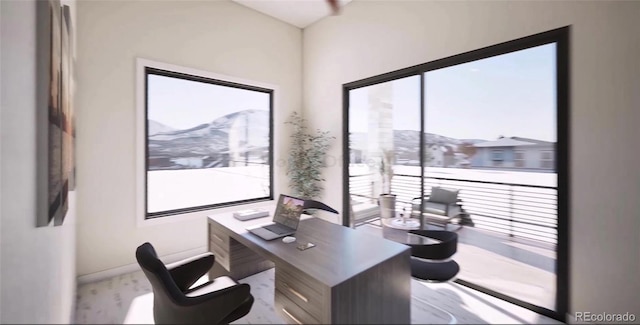 office featuring plenty of natural light and a mountain view