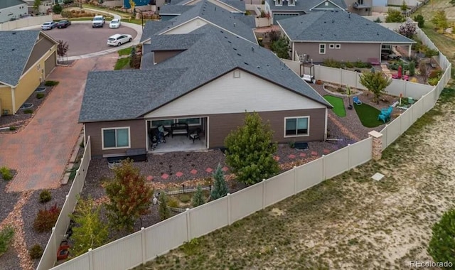6765 Windbrook Ct, Colorado Springs, CO 80927 - view of side of property featuring a residential view, a fenced backyard, and roof with shingles