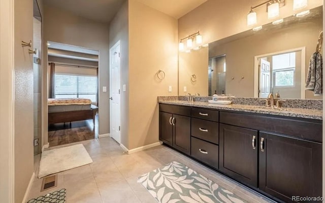 6765 Windbrook Ct, Colorado Springs, CO 80927 - bathroom with double vanity and tile patterned flooring
