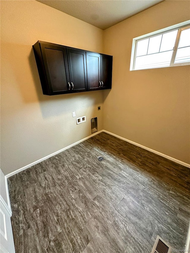6765 Windbrook Ct, Colorado Springs, CO 80927 - washroom featuring electric dryer hookup, cabinet space, and washer hookup