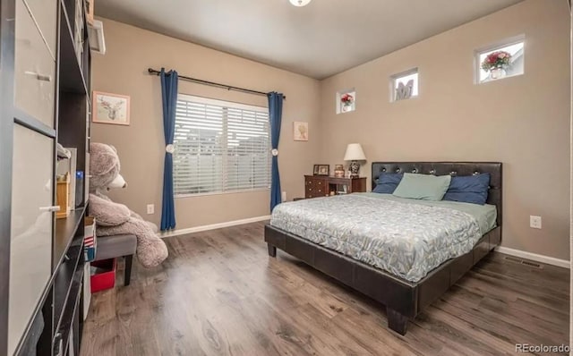 6765 Windbrook Ct, Colorado Springs, CO 80927 - bedroom with wood finished floors and baseboards