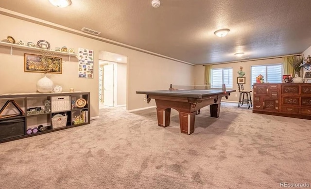 6765 Windbrook Ct, Colorado Springs, CO 80927 - playroom featuring a textured ceiling, light carpet, and crown molding
