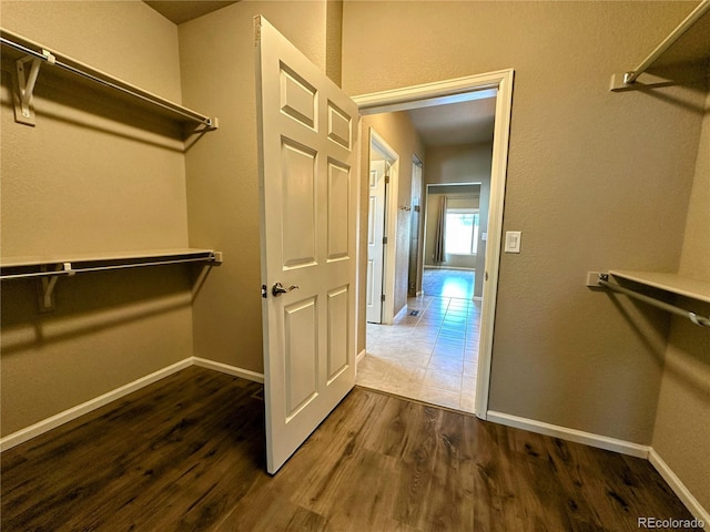 6765 Windbrook Ct, Colorado Springs, CO 80927 - walk in closet featuring dark wood-type flooring