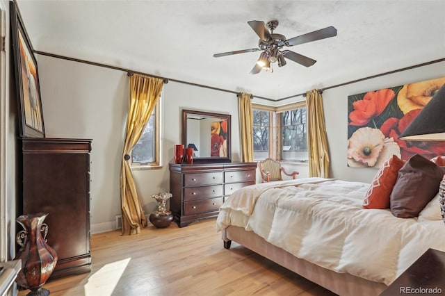 621 Kearney St, Denver, CO 80220 - bedroom featuring baseboards, a ceiling fan, and wood finished floors