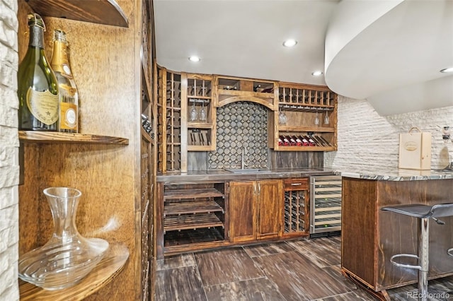 621 Kearney St, Denver, CO 80220 - wine cellar featuring wine cooler, bar area, recessed lighting, and a sink