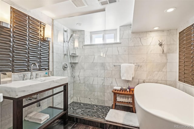 621 Kearney St, Denver, CO 80220 - bathroom featuring a soaking tub, walk in shower, and visible vents