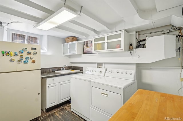 621 Kearney St, Denver, CO 80220 - clothes washing area with a sink, cabinet space, and washing machine and dryer
