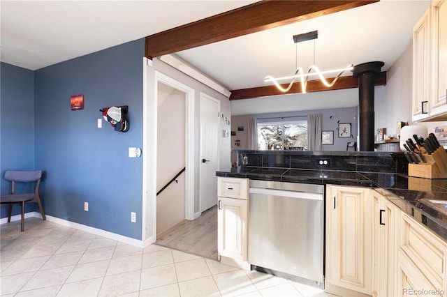 kitchen with hanging light fixtures, beam ceiling, light tile patterned flooring, stainless steel dishwasher, and cream cabinetry