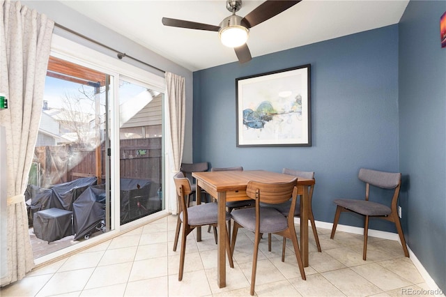 tiled dining room with ceiling fan