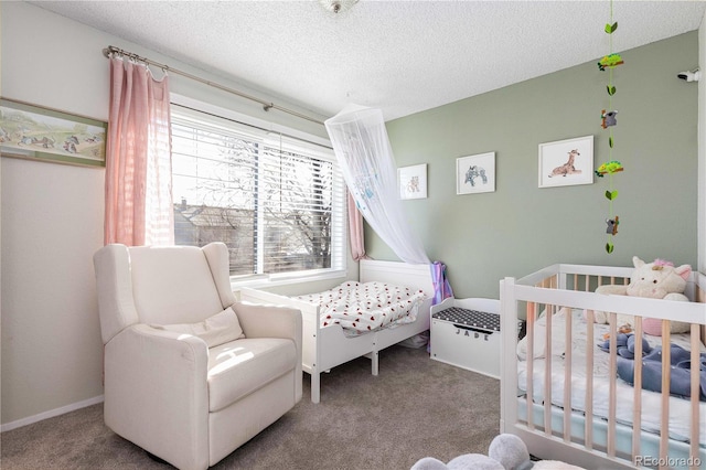 bedroom featuring carpet floors and a textured ceiling