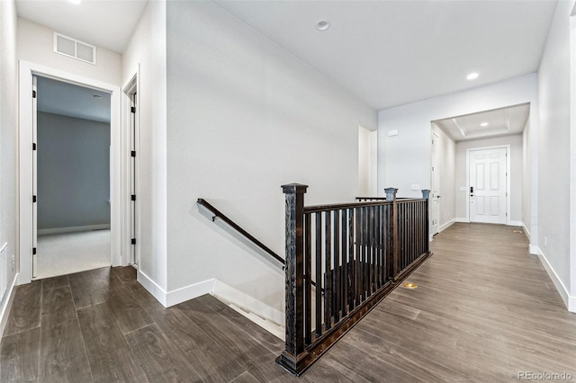 corridor with hardwood / wood-style floors