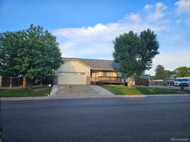 808 Idalia St, Aurora, CO 80011 - single story home featuring an attached garage and concrete driveway