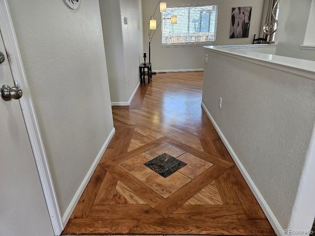 808 Idalia St, Aurora, CO 80011 - corridor featuring baseboards and a textured wall