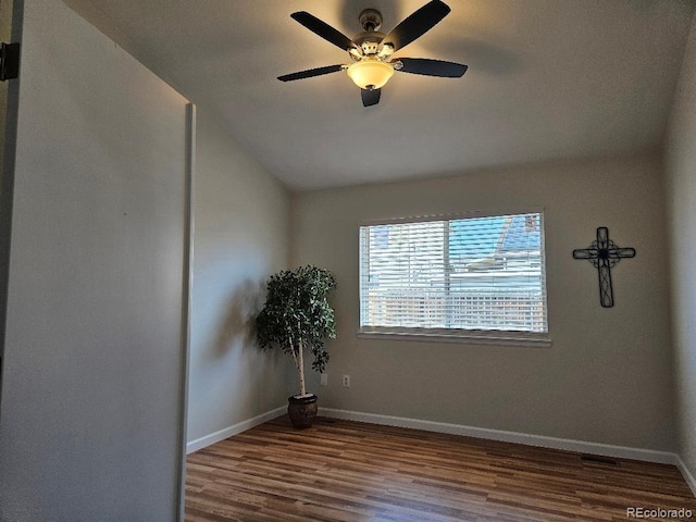 808 Idalia St, Aurora, CO 80011 - unfurnished room with wood finished floors, ceiling fan, baseboards, and vaulted ceiling