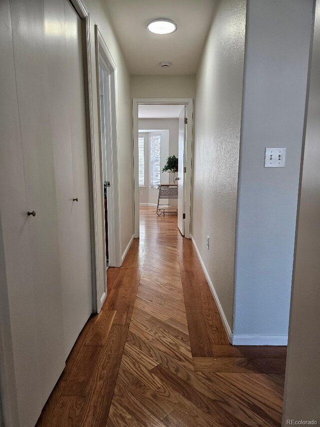 808 Idalia St, Aurora, CO 80011 - hall with wood finished floors and baseboards