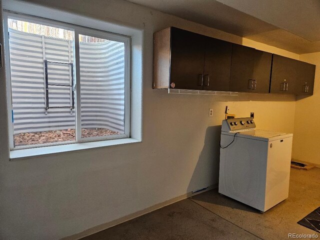 808 Idalia St, Aurora, CO 80011 - washroom with washer / dryer, cabinet space, and baseboards