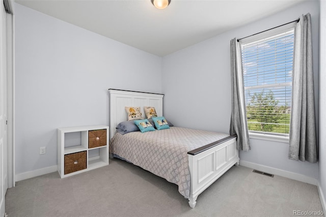 15604 Xenia Way, Brighton, CO 80602 - bedroom with light colored carpet and baseboards