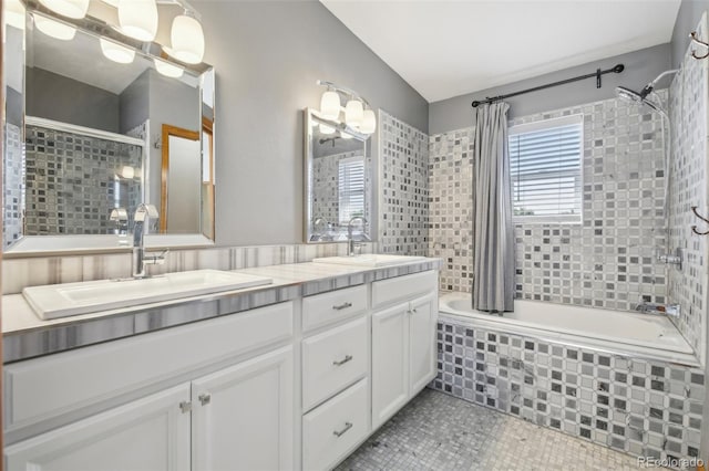 bathroom with vanity, shower / bathtub combination with curtain, and tile patterned floors