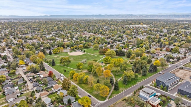 birds eye view of property with a mountain view